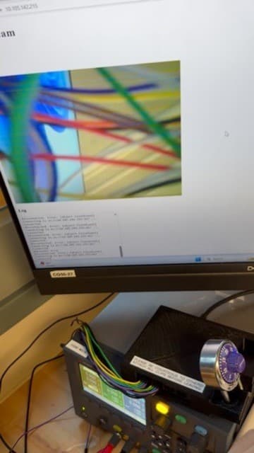 Webcam test setup displaying a newly captured image in a browser above the connected development hardware