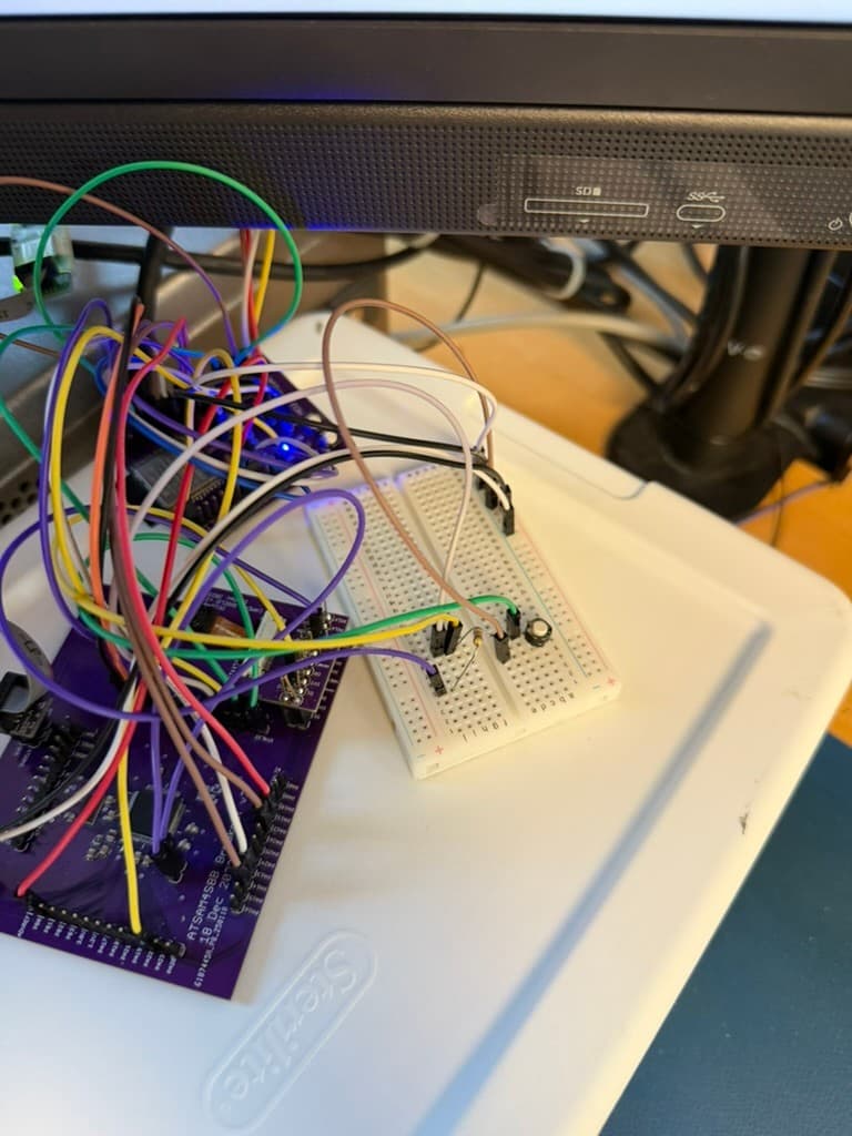 SAM4S8B development board and breadboard circuitry connected with jumper wires during webcam hardware bring-up
