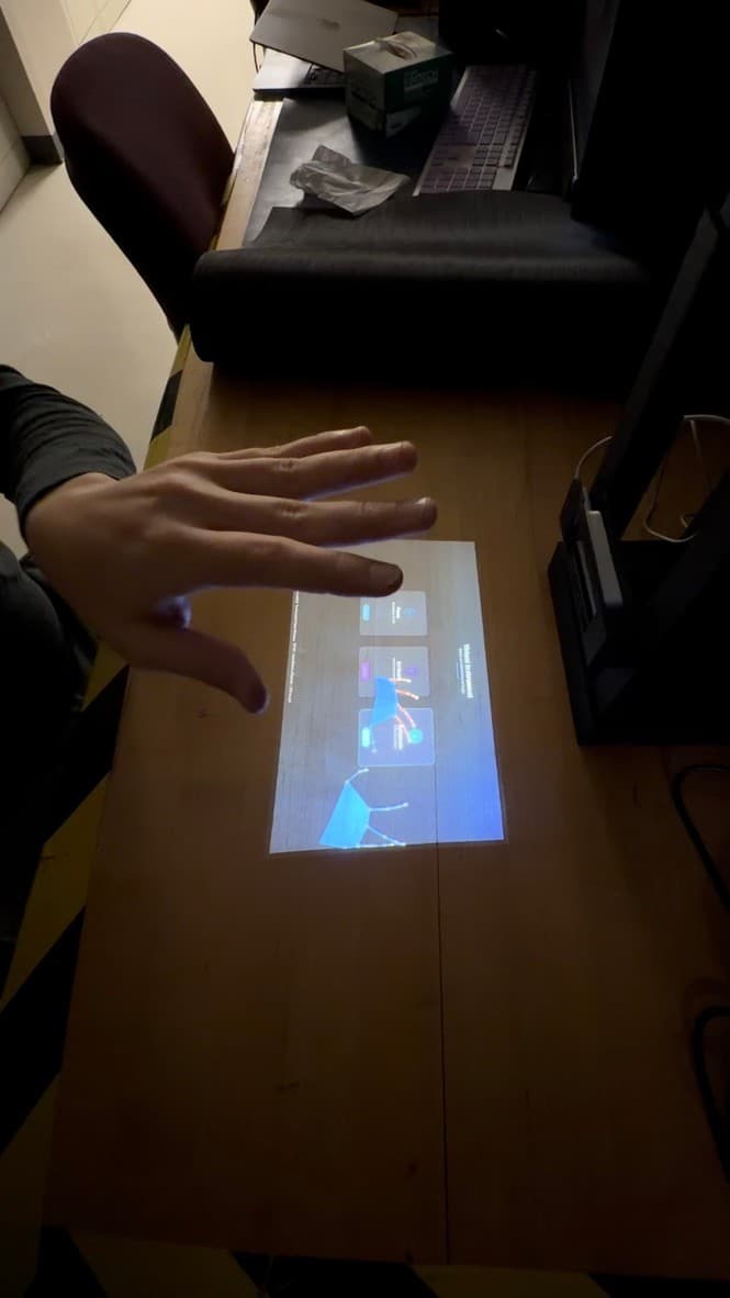Side view of a user moving a hand over the projected instrument menu while fingertip tracking is displayed