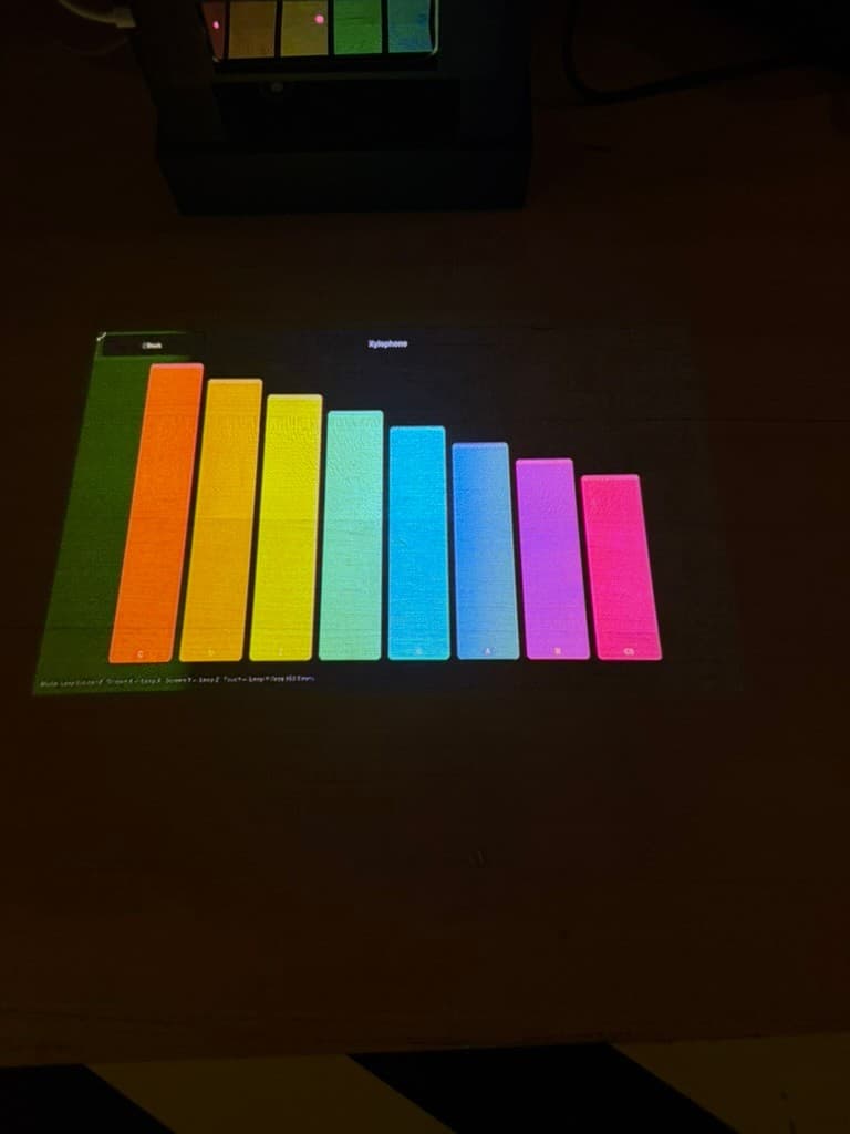 Close view of the projected rainbow xylophone controls and tracking hardware