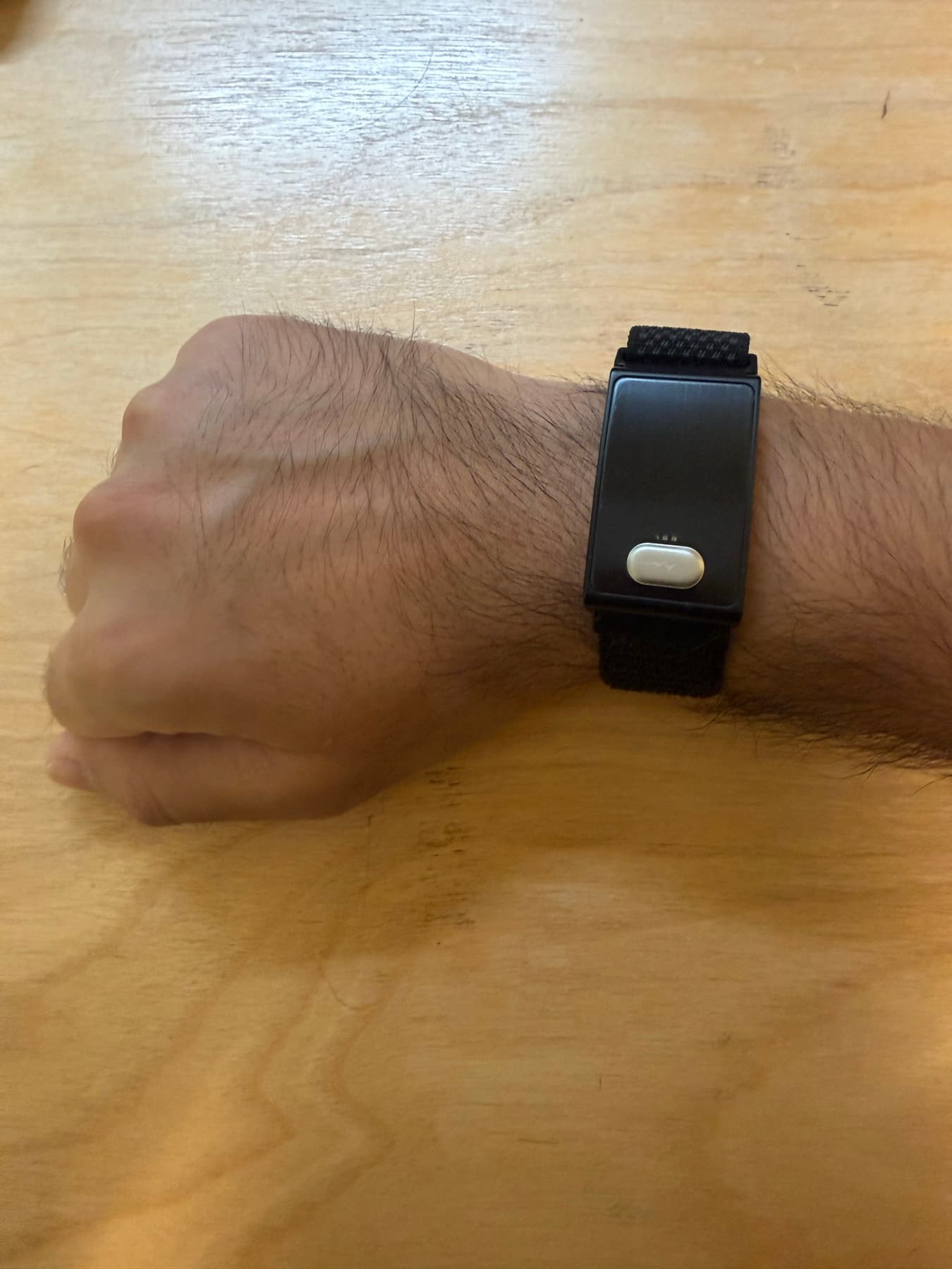 Screenless ES02 wearable used to collect wellness data for the WatchProbe research prototype
